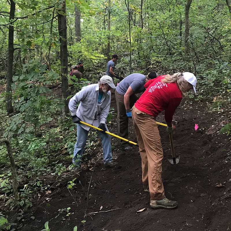 volunteers working on trails